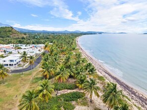 Aerial view of Playa Punta Santiago right next to Villa Palmira community.