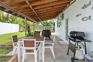 The outdoor patio offers a grill, outdoor table and seating area.