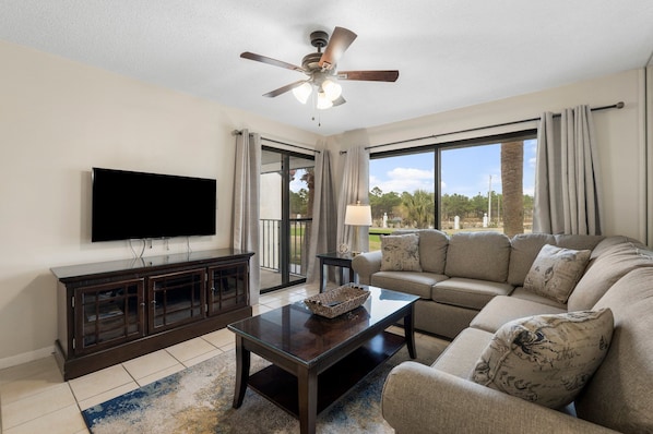 Living Area with Golf Course View, Flat Screen TV, Sleeper Sofa, and Private Balcony Access