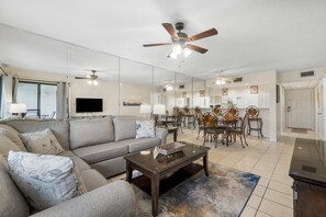 Living Area with Golf Course View, Flat Screen TV, Sleeper Sofa, and Private Balcony Access