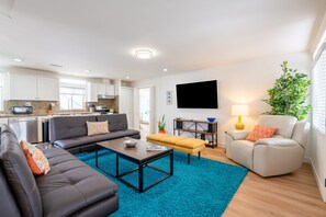 A cozy interior with plush seating and a flat screen TV.
