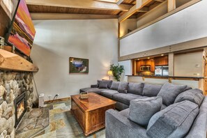 Vaulted ceilings going up to the loft, the open plan living area and kitchen will have everyone together