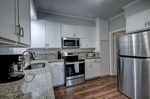 You'll absolutely love the fully appointed kitchen, which offers a wide range of culinary possibilities, complete with modern appliances to make your cooking experience even mor enjoyable.
