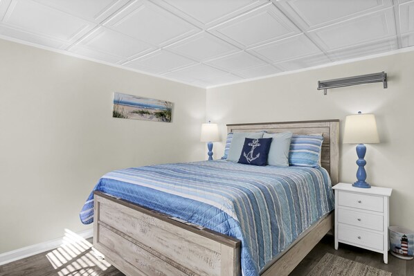 serene bedroom featuring a plush queen-sized bed for ultimate comfort