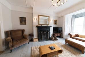 Comfortable lounge with working fire.