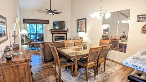 Dining area with seating for 6 at table and 2 at bar