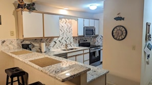 New granite countertops and backsplash, appliances, tile flooring! All you need!