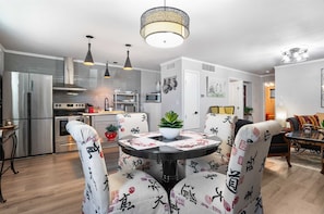 Plush chairs add a touch of tasteful formality to the Asian Zen dining table!