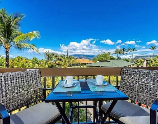 Enjoy the tropical breeze from the condo's lanai (balcony).