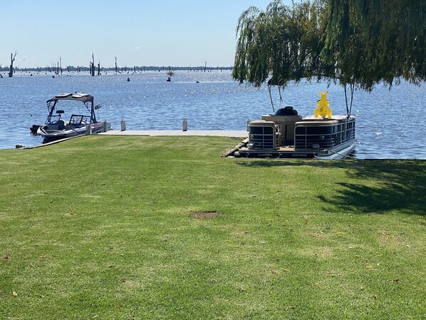 Rear lawn with private jetty