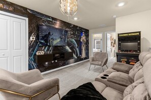 Enjoy quality time with loved ones in our inviting living room, offering a cozy space for relaxation.