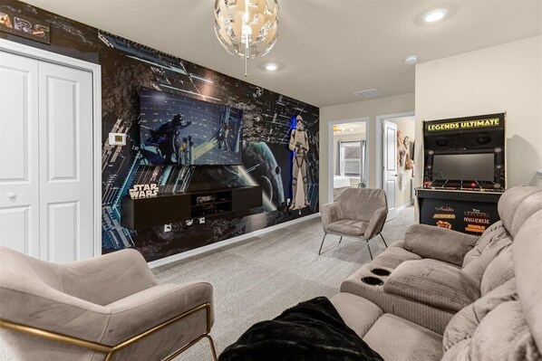 Enjoy quality time with loved ones in our inviting living room, offering a cozy space for relaxation.