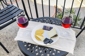 Unwind on the patio with a refreshing glass of wine, soaking in the surroundings.