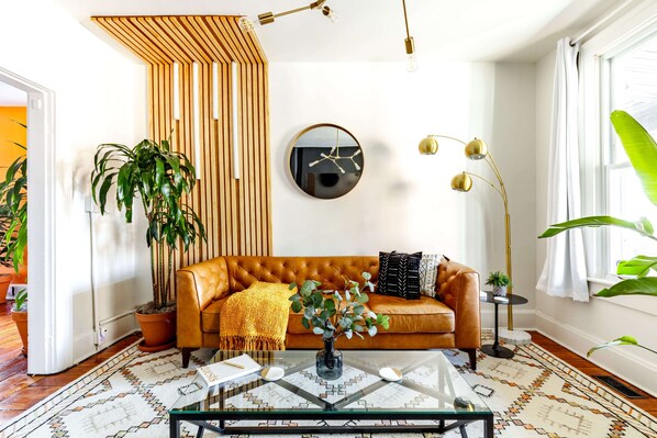 jungle-inspired living room with real plants & earthy tones 🌿 a cozy retreat in the heart of columbus!