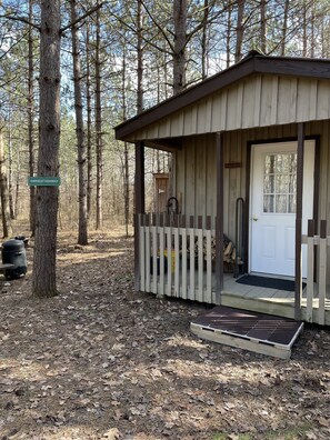 Peaceful woods surround the cabin.