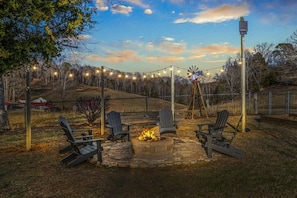 Gather around the Fire Pit in the large, fenced yard