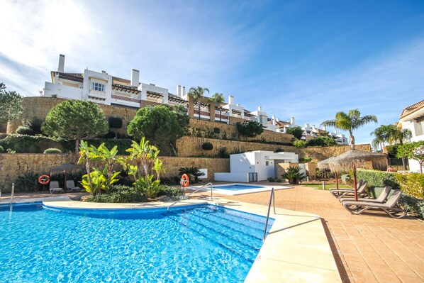 One of two Swimming Pool areas accessible to Guests (Our building in background)
