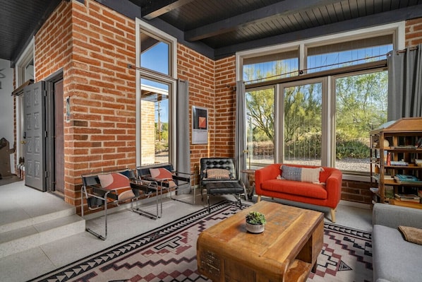 Living room with mountain views and plenty of stylish, mid-century modern furniture to enjoy the 55" smart TV (on the wall to the left)