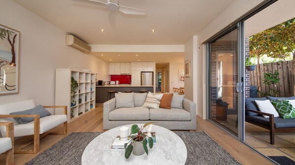 Light and bright living spaces leading to courtyard 