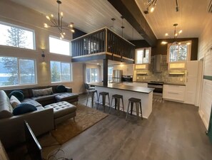 Kitchen island seats 6. Open concept. Dimmable lighting. Vinyl plank flooring.