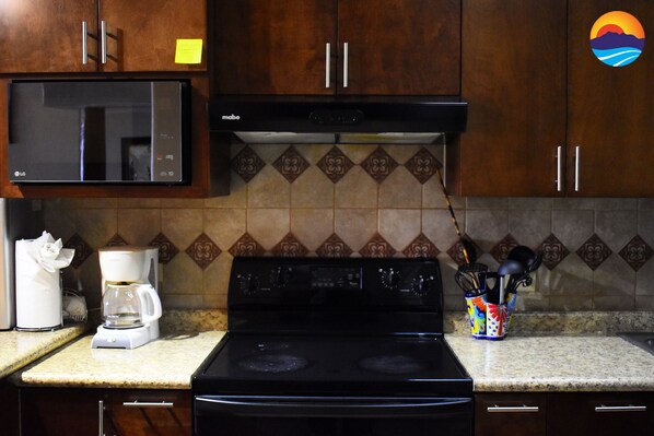 Full kitchen with basic utensils for cooking