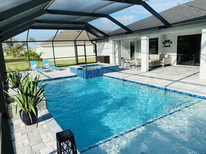 Fully caged pool area with room to dine, relax and swim