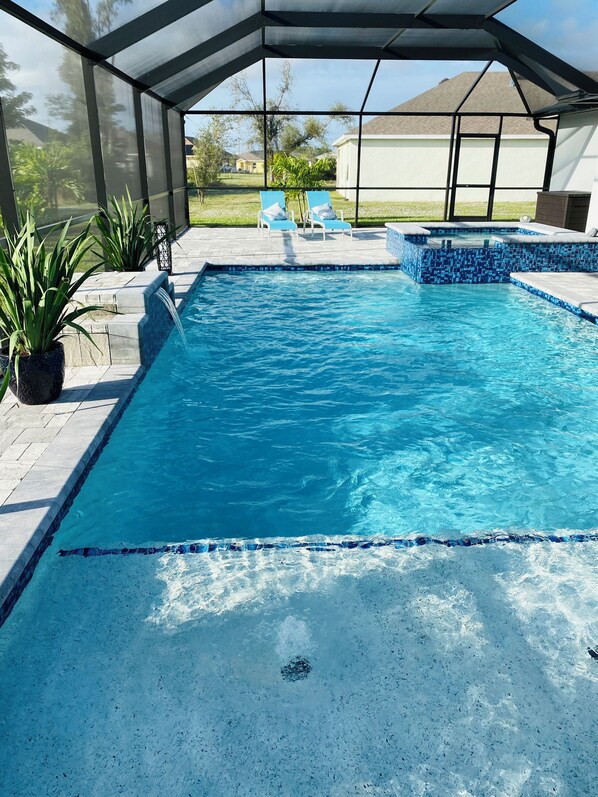 Relaxing saltwater pool with waterfall feature