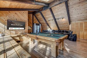 With a pool table for your inner shark, a Smart TV for your binge-watching needs, and seating aplenty for your entourage, it's like having your own private penthouse arcade!