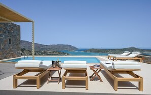 Captivating sea views can be enjoyed from the daybeds on the pool.