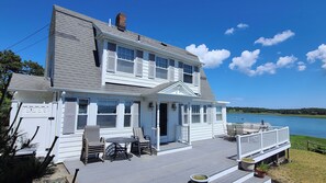 House has a large front deck with gorgeous views and an outdoor shower