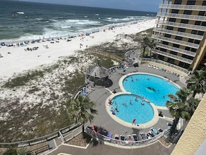 The view from the private balcony. Both community pools are available to guests and you're just steps away from the white sand beaches.