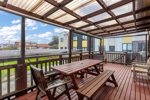 The outdoor covered deck has the option to open or close the covers.