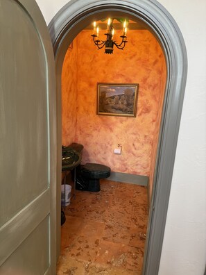 Powder room off foyer.