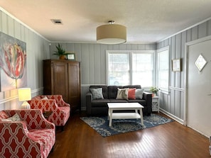 Spacious living room with multiple seating options