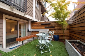 Outdoor patio located on the bottom level. Enjoy morning coffee, a happy hour or even a meal!