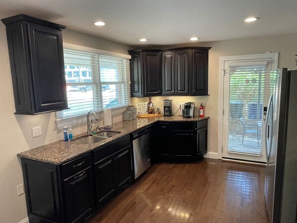 Granite counters and stainless appliances await in the kitchen.  Keurig and fresh ground local coffee is provided! 