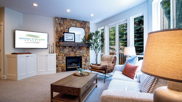 Living Area with Fireplace, Smart TV & loads of natural light