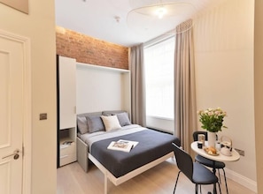 Comfortable wall bed. Latest technology system, easy to use and space efficient to enjoy as much as possible your stay. The bed will be ready for your arrival.