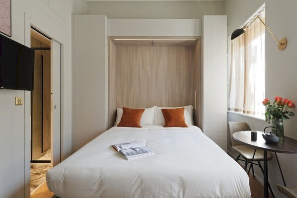 Open bed and TV.