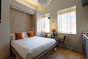 Comfortable bed. Please, note that the bed will be open and ready for your arrival. It's a wall bed, with the newest technology available. Super convenient and space-efficient!