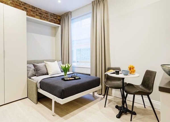 Comfortable wall bed. Latest technology system, easy to use and space efficient to enjoy as much as possible your stay. The bed will be ready for your arrival.