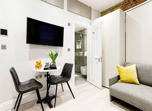 Access to the private bathroom. The wall bed can be easily folded into a comfortable sofa for your commodity.