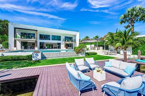 The overwater deck on the tranquil Mayan Lake with its lavish tropical foliage.