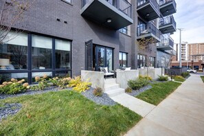 Private patio accessible from the living area featuring outdoor furniture. (Unit 2)