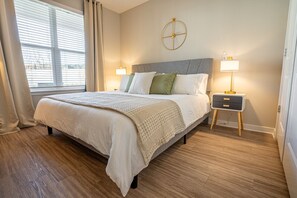 Second king bedroom with dresser, walk-in closet and smart TV