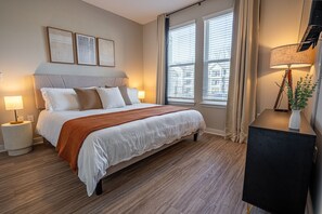Master Bedroom where you can sink into the King memory foam mattress after a long day. The bedroom also features an en suite bathroom with dual sinks, a stand-in shower and walk-in closet!