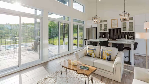 Living room with access to the outdoor patio and scenic views