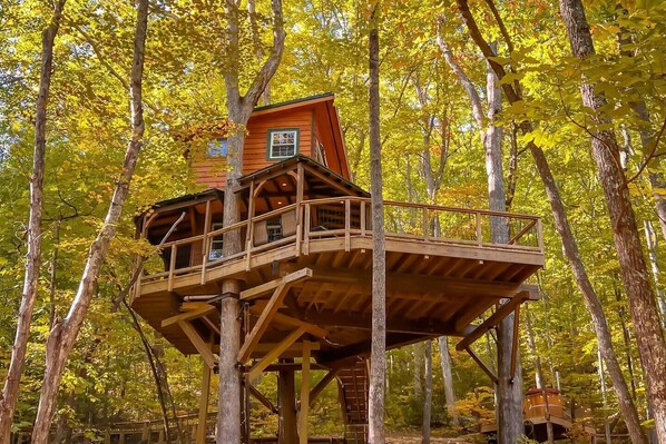 Our largest treehouse, the Rubicon, which sleeps 4 with a queen bed upstairs and a queen pull out sofa on the main level.