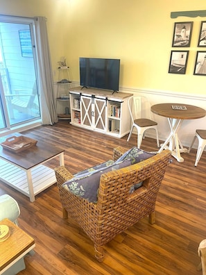 Living room with new TV. Cable and DVD player provided