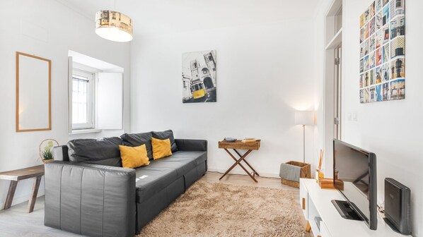 The combination of minimalist design elements and the influx of sunlight create a contemporary and inviting living area #airbnblisboa #wonderful #cozy #home